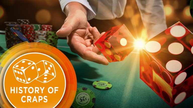 The dealer casts the dice on the craps table.