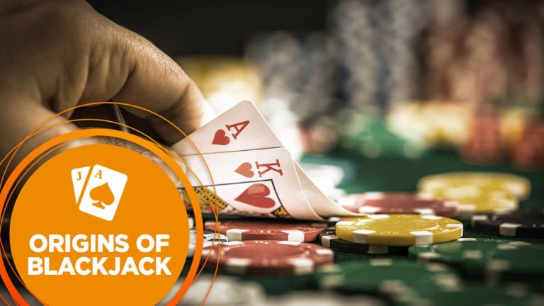 A player examines their blackjack cards, revealing the Ace and King of Hearts.