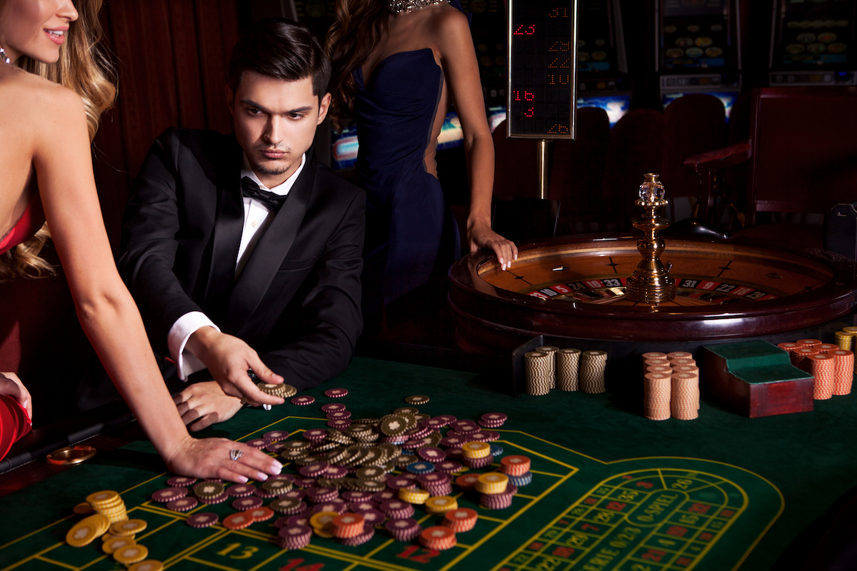 High-stakes tables filled with poker chips create an electrifying atmosphere in casino gaming.